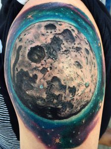 ugly moon shoulder tattoo